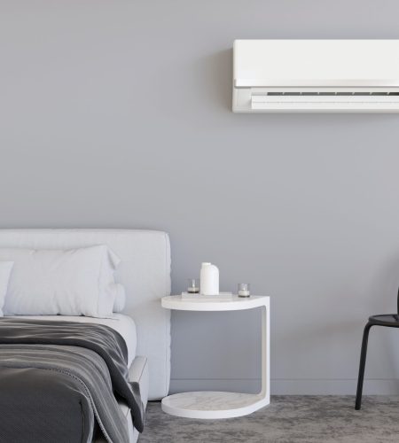 Modern air conditioner hanging on the wall in room. Cooling product for hot climate in summer. Machine which keeps the air in a building cool and dry. Modern interior with air-conditioning. 3D render