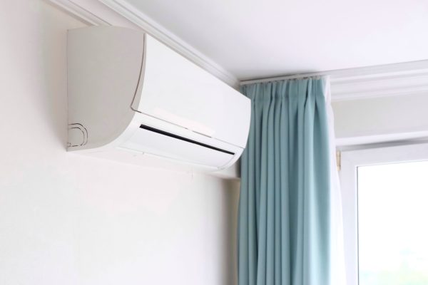modern-air-conditioner-on-white-wall-indoors-2025-01-08-10-09-33-utc